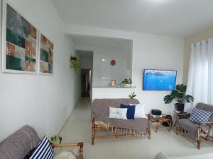 TV/trung tâm giải trí tại Casa Aconchego de Jacuípe, Ar condicionado e Piscina Privativa