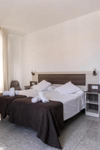 Postel nebo postele na pokoji v ubytování Mesón Hostal La Cabaña