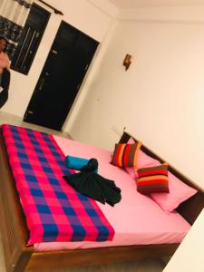 Postel nebo postele na pokoji v ubytování Navodya Guest Mirissa