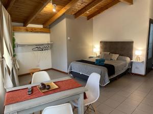 En eller flere senge i et værelse på Loft en zona centrica gastronómica D9