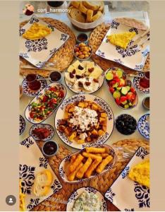 a table with many plates of food on it at Aişem By Hire in Alaçatı