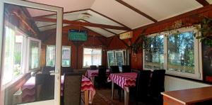 a dining car of a train with tables and chairs at Guest house Mirijevski Konak in Belgrade