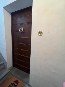 a wooden door in a room with a door at Maison Sferisterio in Macerata