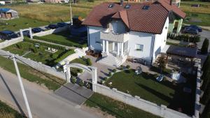 an overhead view of a white house with a fence at White House Plitvice in Korenica