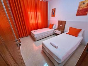 Postel nebo postele na pokoji v ubytování Prestige Apartment Oued Laou