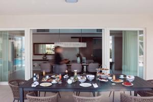a black table with food on it in a room at Celine in Savudrija