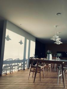 a dining room with a table and chairs at Single room in Trondheim