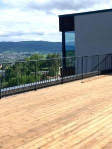 a balcony of a building with a view of a city at Single room in Trondheim