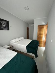 سرير أو أسرّة في غرفة في STILLO AÇAI