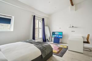 Posteľ alebo postele v izbe v ubytovaní New Apartment near Champs Elysées