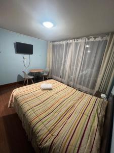 Cama ou camas em um quarto em Zenteno Apartments