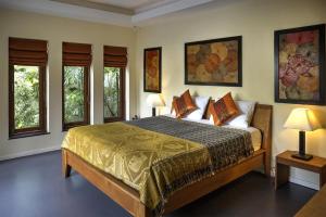 a bedroom with a large bed and two windows at Romantic 1 Bed Villa with Pool - 150 mtrs to beach in Koh Samui  +33 photos