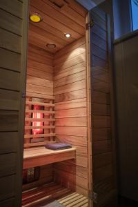 a sauna with a bench in a wooden room at Haus Nicola in Bad Gastein