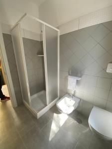 a bathroom with a shower and a toilet at Casa Al Lago B&B in Foiano di Val Fortore