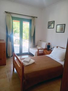 Postel nebo postele na pokoji v ubytování Christine House Platanias