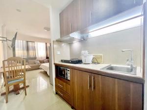 a kitchen with a sink and a counter top at RESIDENCE D ANKADIFOTSY in Antananarivo