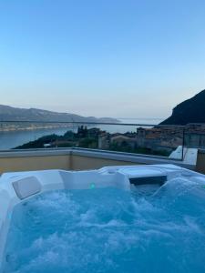 a hot tub on the roof of a building at Residence La Villa Tignale in Tignale