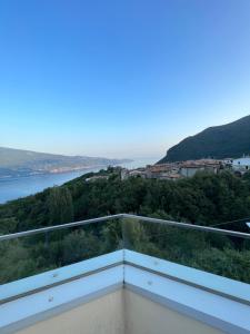 a balcony with a view of the water at Residence La Villa Tignale in Tignale