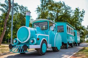 two blue buses are parked next to each other at Polidor Glamping Resort in Poreč