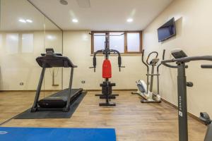 a gym with several cardio equipment in a room at Polidor Glamping Resort in Poreč
