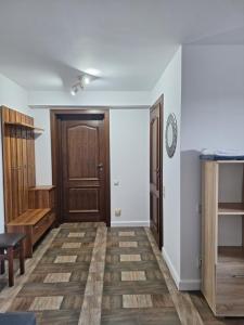 Fotografia z galérie ubytovania Leśny Dworek - Apartamenty SUPER z TV i salonem kominkowym v destinácii Mrągowo