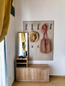 a dressing room with a mirror and a dresser at Bar Aperol Apartment in Bar