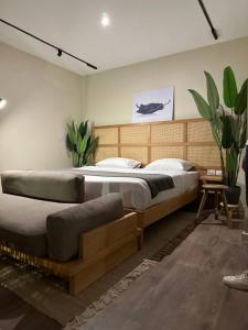 a bedroom with a large bed with a wooden headboard at Suite 69 in Hurghada +44 photos