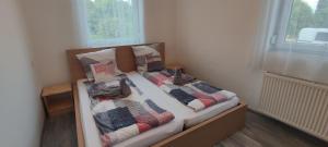 Posteľ alebo postele v izbe v ubytovaní Lali Apartman