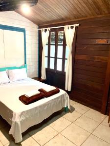 Cama ou camas em um quarto em Casa Selva - Vila do Abraão - Ilha grande