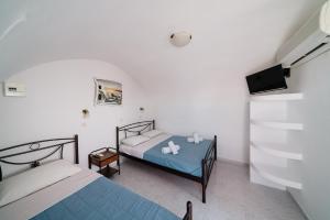Uma cama ou camas num quarto em Villa Dima