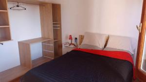 a bedroom with a bed and a book shelf at Centrico 07 in General Roca