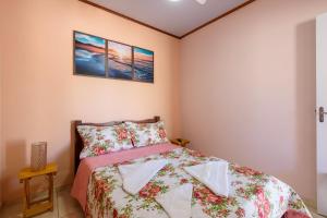 Un pat sau paturi într-o cameră la Recanto Dantas, aconchego em Paraty