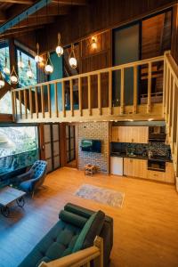 a living room with a couch and a staircase at timya sapanca in Sapanca