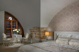 Rúm í herbergi á Lighthouse Suite - Acre