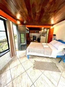 Cama ou camas em um quarto em Casa Selva - Vila do Abraão - Ilha grande