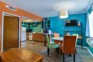 a kitchen and dining room with a table and chairs at Charming 2 Bedroom Near Downtown - Rose Tree 1 in Moab