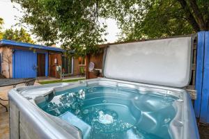 a hot tub in the backyard of a house at Charming 2 Bedroom Near Downtown - Rose Tree 1 in Moab