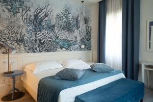 Postel nebo postele na pokoji v ubytování Hotel Bellonda