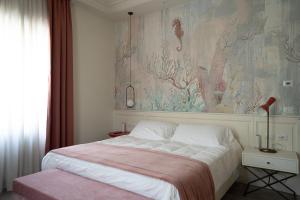 Postel nebo postele na pokoji v ubytování Hotel Bellonda