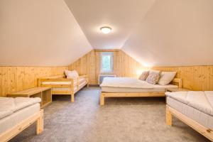 Postel nebo postele na pokoji v ubytování Apartmány Pod Šerákem