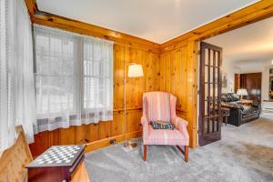 een woonkamer met een stoel en een bank bij Clifford Home about 8 Mi to Elk Mountain Ski Resort! in Clifford