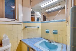 a bathroom with a sink and a mirror at 8 Mi to Elk Mountain Ski Resort Clifford Home! in Clifford +20 photos