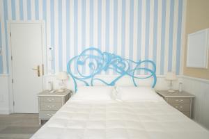 Postel nebo postele na pokoji v ubytování Hotel Bellonda