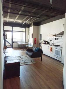 a living room with a couch and a table at Albergue HR in Sarria