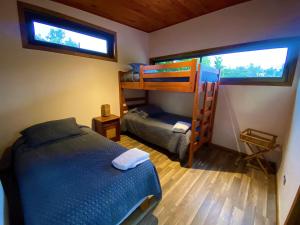 A bed or beds in a room at Cabañas La Luz