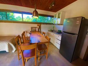 A kitchen or kitchenette at Cabañas La Luz