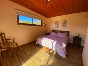 A bed or beds in a room at Cabañas La Luz