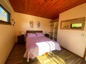 A bed or beds in a room at Cabañas La Luz