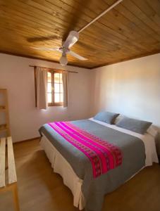 Cama ou camas em um quarto em Cabañas Doña Juanita