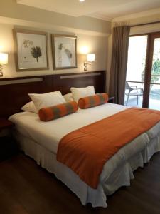 Postel nebo postele na pokoji v ubytování Hotel y Cabañas Palomar - Caja los Andes